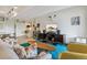 Comfortable living room with stylish furniture, a bright blue rug, and a modern entertainment center at 1255 N Ogden St # 605, Denver, CO 80218