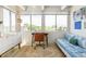 Bright office space with large windows, a cozy daybed, and a view of the city skyline at 1255 N Ogden St # 605, Denver, CO 80218