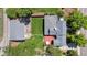 Aerial view of a home with a spacious backyard, deck, detached garage, and mature trees at 2311 W 46Th Ave, Denver, CO 80211