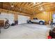 Spacious three car garage with natural light featuring high ceilings and plenty of storage space at 2311 W 46Th Ave, Denver, CO 80211