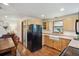 Well-appointed kitchen featuring wood cabinetry, farmhouse sink, and stainless steel appliances at 2311 W 46Th Ave, Denver, CO 80211
