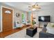 Inviting living room with hardwood floors, lots of natural light, and a relaxed seating arrangement at 2311 W 46Th Ave, Denver, CO 80211