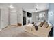Living room with a fireplace, large windows and a comfortable sectional sofa, creating an inviting space at 17442 Nature Walk Trl # 105, Parker, CO 80134