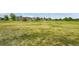 Expansive green lawn with playground and outdoor seating, perfect for Gathering fun and community gatherings at 17442 Nature Walk Trl # 105, Parker, CO 80134