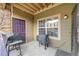 A private patio with grilling setup, offering an outdoor space for relaxation and dining at 17442 Nature Walk Trl # 105, Parker, CO 80134