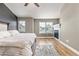 Spacious bedroom featuring wood floors, fireplace, and large windows for natural light at 5906 S Youngfield Way, Littleton, CO 80127