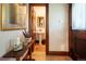 Traditional bathroom showcasing a pedestal sink, a wood-framed mirror, and classic wood trim throughout at 669 S Washington St, Denver, CO 80209
