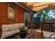 Relaxing covered deck with furniture, providing a comfortable outdoor living space with access to the yard at 669 S Washington St, Denver, CO 80209