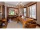 Charming dining room with natural light, hardwood floors, and a stylish chandelier at 669 S Washington St, Denver, CO 80209