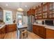 Bright kitchen with wood cabinets, stainless steel appliances, and access to the outdoor deck at 669 S Washington St, Denver, CO 80209