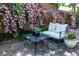 Outdoor seating area with pink roses climbing on the fence and patio at 669 S Washington St, Denver, CO 80209