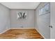 Bedroom with hardwood floors, neutral paint, and a window with natural light at 6895 W Oregon Dr, Lakewood, CO 80232