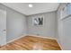 Bedroom boasting hardwood floors, neutral paint, and ample natural light from the window at 6895 W Oregon Dr, Lakewood, CO 80232
