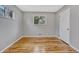 Bedroom featuring hardwood floors and a window with natural light at 6895 W Oregon Dr, Lakewood, CO 80232