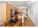 Bright kitchen featuring wooden cabinets, stainless steel appliances, and a breakfast bar at 340 S Lafayette St # 201, Denver, CO 80209