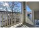 Balcony with view of trees and neighboring building at 3876 Canyon Ranch Rd # 202, Highlands Ranch, CO 80126