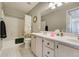 Bathroom with double vanity, tub, and shower at 3876 Canyon Ranch Rd # 202, Highlands Ranch, CO 80126