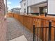 Narrow gravel backyard, enclosed by a wooden fence, offering a low-maintenance outdoor space at 379 Remuda Rd, Berthoud, CO 80513