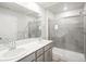 Contemporary bathroom featuring a double sink vanity, frameless glass shower, and modern fixtures at 379 Remuda Rd, Berthoud, CO 80513
