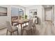 Dining area with wood table, chairs, and sliding glass doors to outdoor deck at 379 Remuda Rd, Berthoud, CO 80513