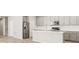 Kitchen features stainless steel appliances, island with sink, and gray cabinets at 379 Remuda Rd, Berthoud, CO 80513