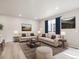 Bright living room with two sofas, a coffee table, and decorative artwork at 379 Remuda Rd, Berthoud, CO 80513
