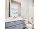 Bright bathroom featuring a tub and shower combo, vanity with sink and cabinet at 1699 Morgan Dr, Erie, CO 80516
