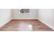 Bedroom with wood-look flooring and natural light at 1699 Morgan Dr, Erie, CO 80516