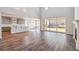 Spacious great room features hardwood flooring, high ceilings, and abundant natural light at 1699 Morgan Dr, Erie, CO 80516