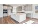 Gourmet kitchen showcases stainless steel appliances, custom cabinets, and a large island at 1699 Morgan Dr, Erie, CO 80516