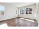 Bright and spacious living room with hardwood flooring and multiple windows at 1699 Morgan Dr, Erie, CO 80516