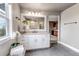 Bathroom featuring a double vanity, large window and a tile shower, connecting to a wet bar at 6345 S Ider Way, Aurora, CO 80016