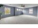 Spacious bonus room with multiple windows, offering natural light and scenic views at 6345 S Ider Way, Aurora, CO 80016