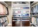 Closet with custom shelves and drawers providing plenty of storage space for clothing at 6345 S Ider Way, Aurora, CO 80016