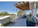 Outdoor deck featuring a covered dining area with a table and chairs, and a pet area at 6345 S Ider Way, Aurora, CO 80016