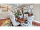 Formal dining room featuring hardwood floors, large table and elegant decor at 6345 S Ider Way, Aurora, CO 80016