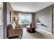 Sitting room with cozy furniture, neutral paint, and large picture window with a view at 6345 S Ider Way, Aurora, CO 80016