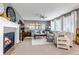 Cozy living room featuring a fireplace, comfortable seating, and elegant decor at 6345 S Ider Way, Aurora, CO 80016