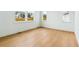 Bright, modern bedroom with large windows and wood-look flooring at 9322 Quaker St, Arvada, CO 80007