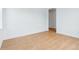 Clean, bright bedroom with light wood flooring and minimalist design at 9322 Quaker St, Arvada, CO 80007