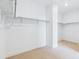 Spacious walk-in closet featuring ample shelving and hanging space for organized storage solutions at 9322 Quaker St, Arvada, CO 80007