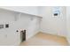 Convenient laundry room with utility connections and ample space, making laundry tasks easy and efficient at 9322 Quaker St, Arvada, CO 80007