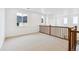 Spacious loft area with neutral carpet and natural light at 9322 Quaker St, Arvada, CO 80007