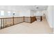 Bright loft area with wood railing, offering views and natural light at 9322 Quaker St, Arvada, CO 80007