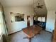 Dining room with a wooden table and a large, decorative mirror on the wall at 2875 E 124Th Way, Thornton, CO 80241