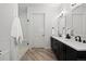 Stylish bathroom showcasing double vanities and a glass-enclosed shower at 4625 W 50Th Ave # 304, Denver, CO 80212