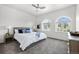 Well-lit bedroom featuring a cozy bed, neutral tones, and large windows at 4625 W 50Th Ave # 304, Denver, CO 80212