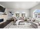Inviting living room with a cozy fireplace, elegant furnishings, arched windows, and sophisticated interior design at 4625 W 50Th Ave # 304, Denver, CO 80212