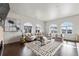 Inviting living room featuring arched windows and a cozy seating arrangement at 4625 W 50Th Ave # 304, Denver, CO 80212