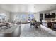 Bright living area featuring a spacious kitchen, lounge area, dining table, and arched windows at 4625 W 50Th Ave # 304, Denver, CO 80212